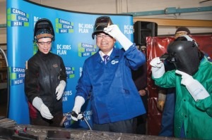 Advanced Education Minister John Yap tries his hand at welding earlier this month at Capilano University