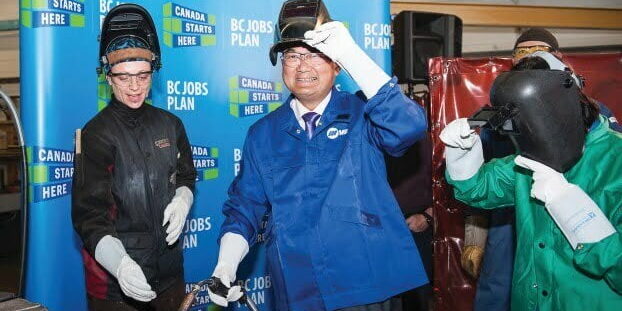 Advanced Education Minister John Yap tries his hand at welding earlier this month at Capilano University