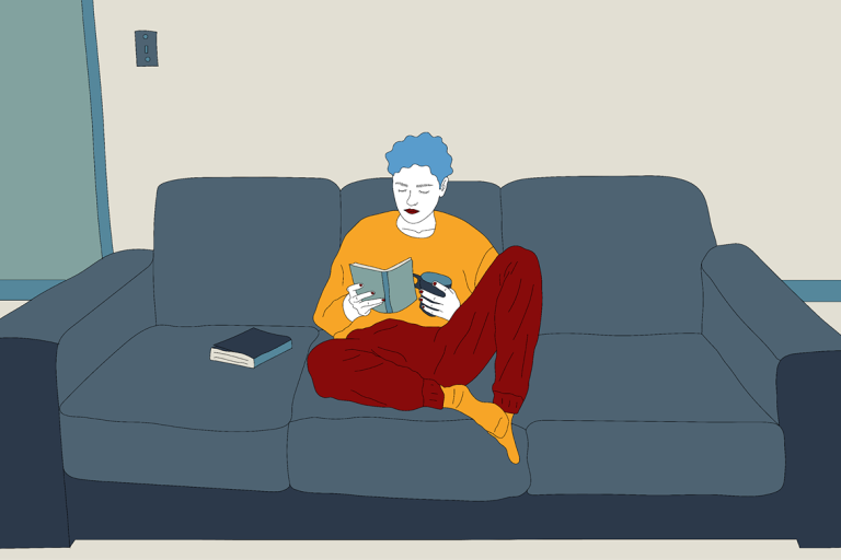 mixkit-person-sitting-on-the-couch-drinking-coffee
