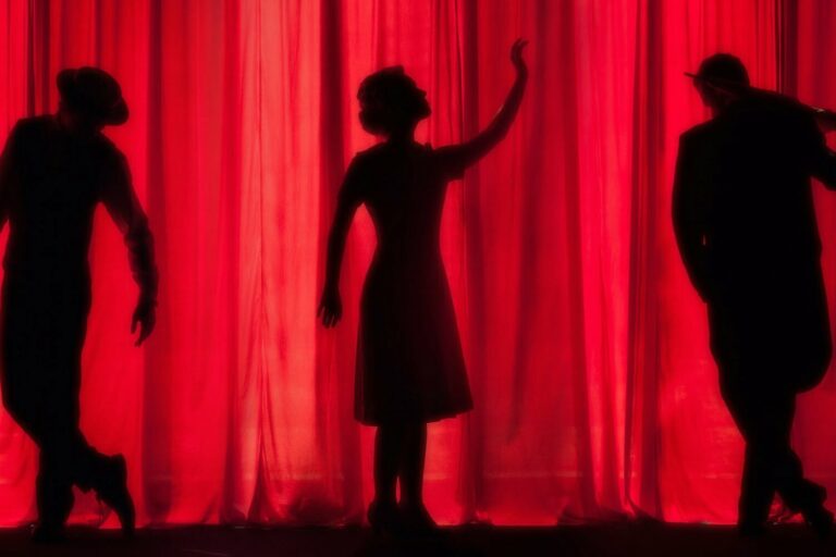 People sillouette on stage