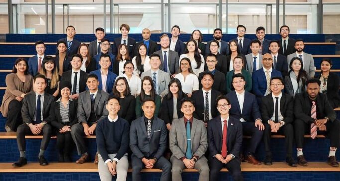 JDC delegates sitting on bleachers