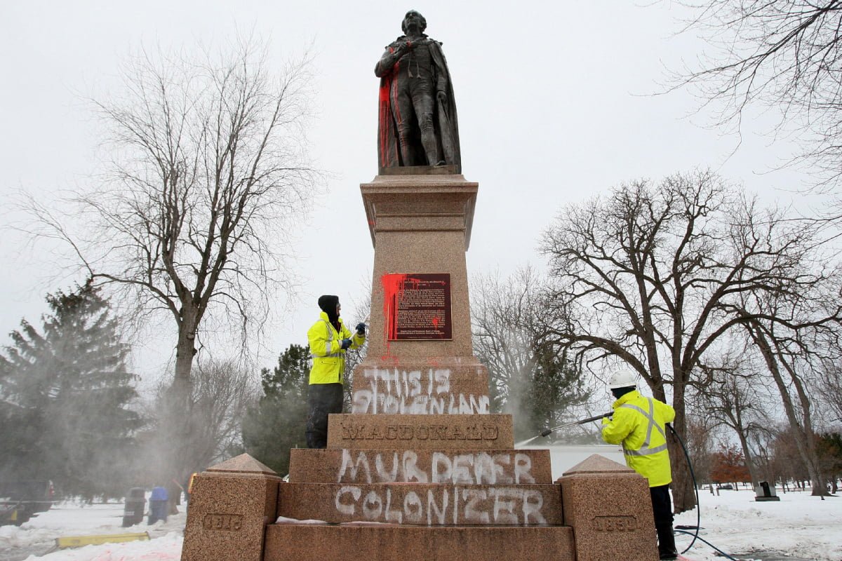 The John A Macdonald Statue in Montreal, covered with the message of those hurt by his legacy