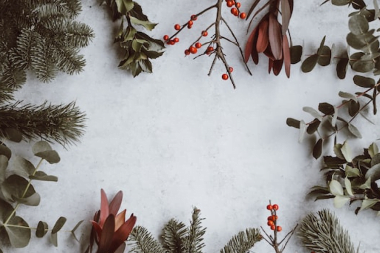 Green christmas branches laying in the snow