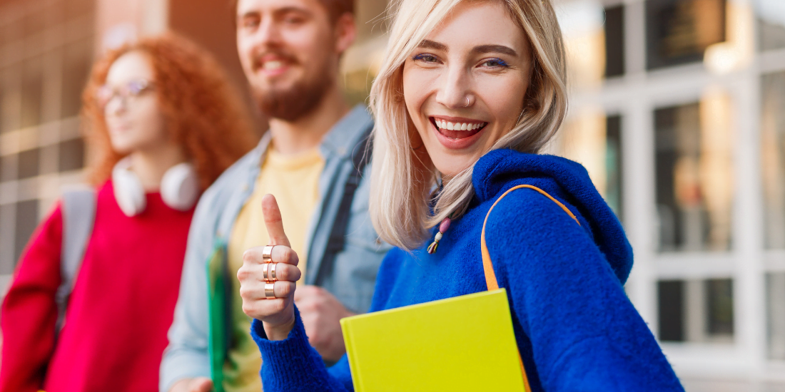 blond girl giving thumbs up