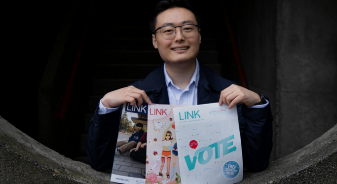 sean featured man holding three magazines