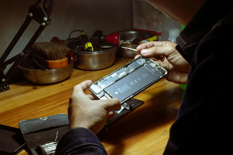 man fixing phone