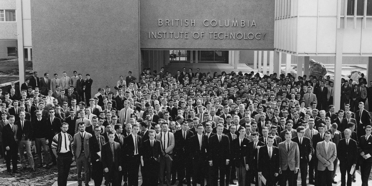 group of men in suits in front of bcit