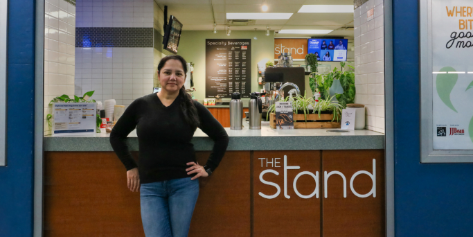 Harpreet Harpreet standing in front of the stand store